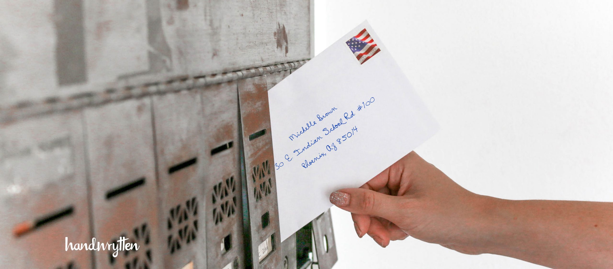 person mailing an envelope