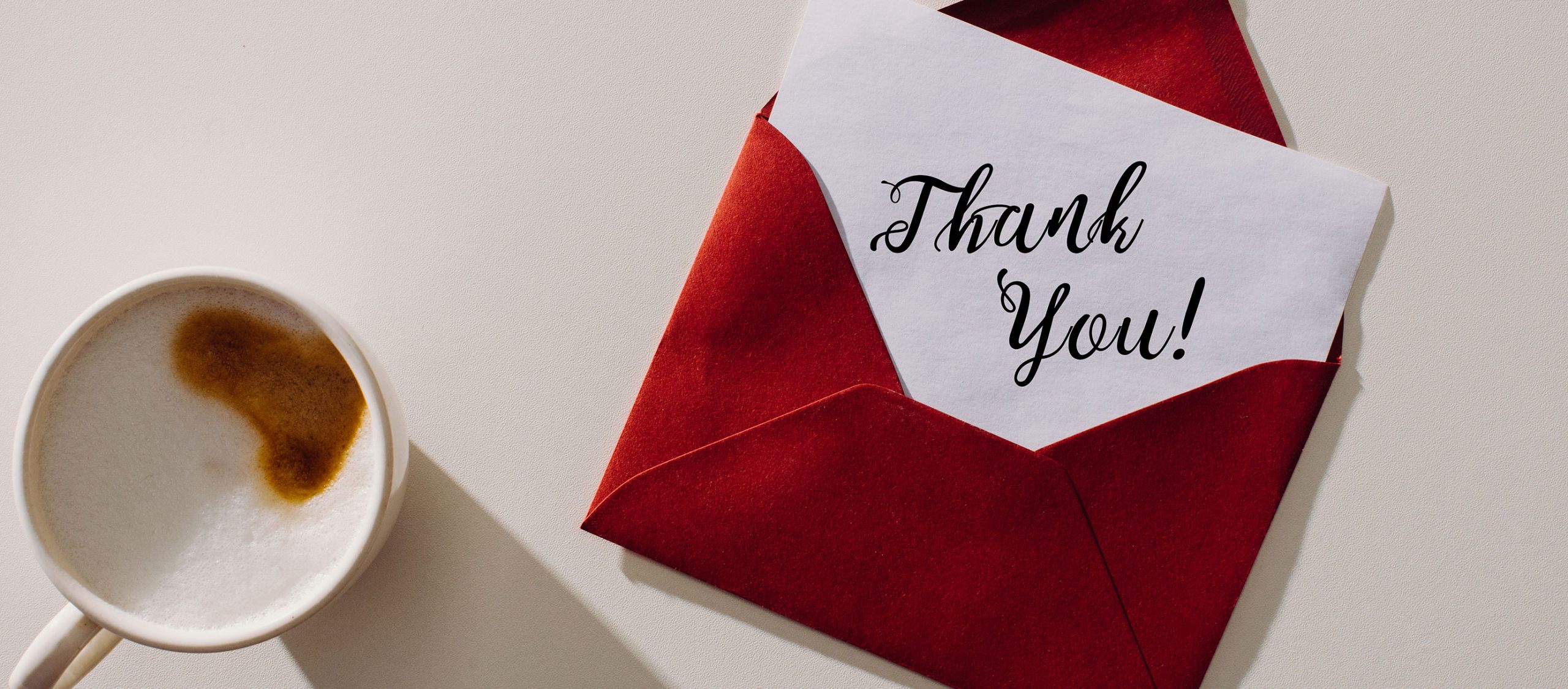 picture of a letter that says thank you in a red envelope